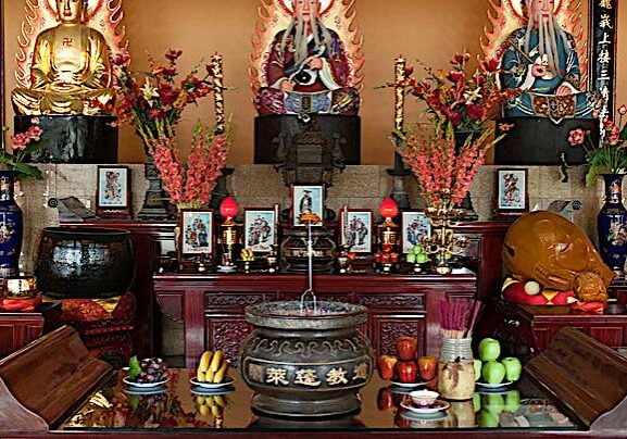 Buddha-Weekly-A Shrine at Fung Loy Taoist Tao Chi International Centre and Temple Buddha Confusius and Lao Tzi together-Buddhism In many temples, including this one in Canada, the shrine typically has, as three principle deities: Buddha (here on left); Lao-Tzu (founder of Taoism) and Confucius. Combining these three traditions raises no eyebrows in Asia, since the philosophies and beliefs are similar (in many ways) and complimentary. Pictured Fung Loy Taoist Tai Chi International Centre near Orangeville, Ontario.