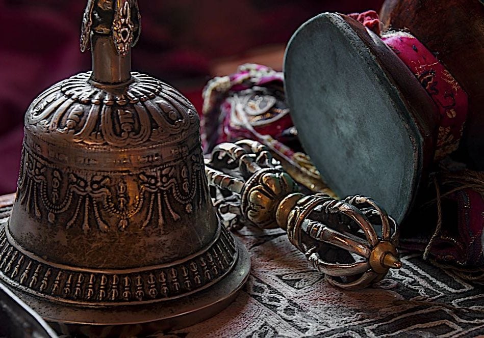 Buddha-Weekly-Bell and Vajra dreamstime_xl_71180903-Buddhism Bell, Vajra and Damaru drum are ubiquitous in Vajrayana Buddhism. The bell and Vajra are always together, and when not in use should be side-by-side, ideally touching. The Bell represents wisdom — the sound of the bell being the sound of Emptiness or Shunyata; the Vajra (or dorje in Tibetan) represents adamantine Compassion and skillfull means, represented by the Diamond vajra, a symbol of the lightning bolt.