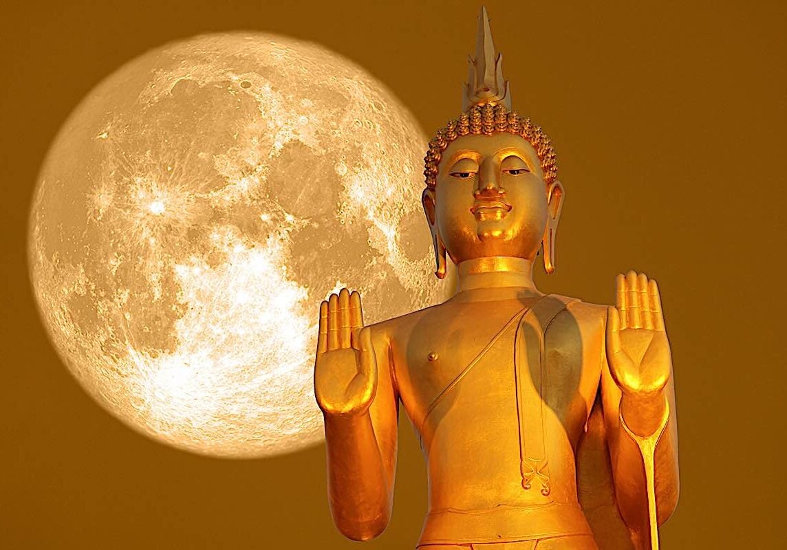 Buddha-Weekly-Buddha full moon. jpg-Buddhism Buddha statue against a full moon. Lunar calendar is very important in Buddhism, with most major events celebrated according to the lunar calendar.