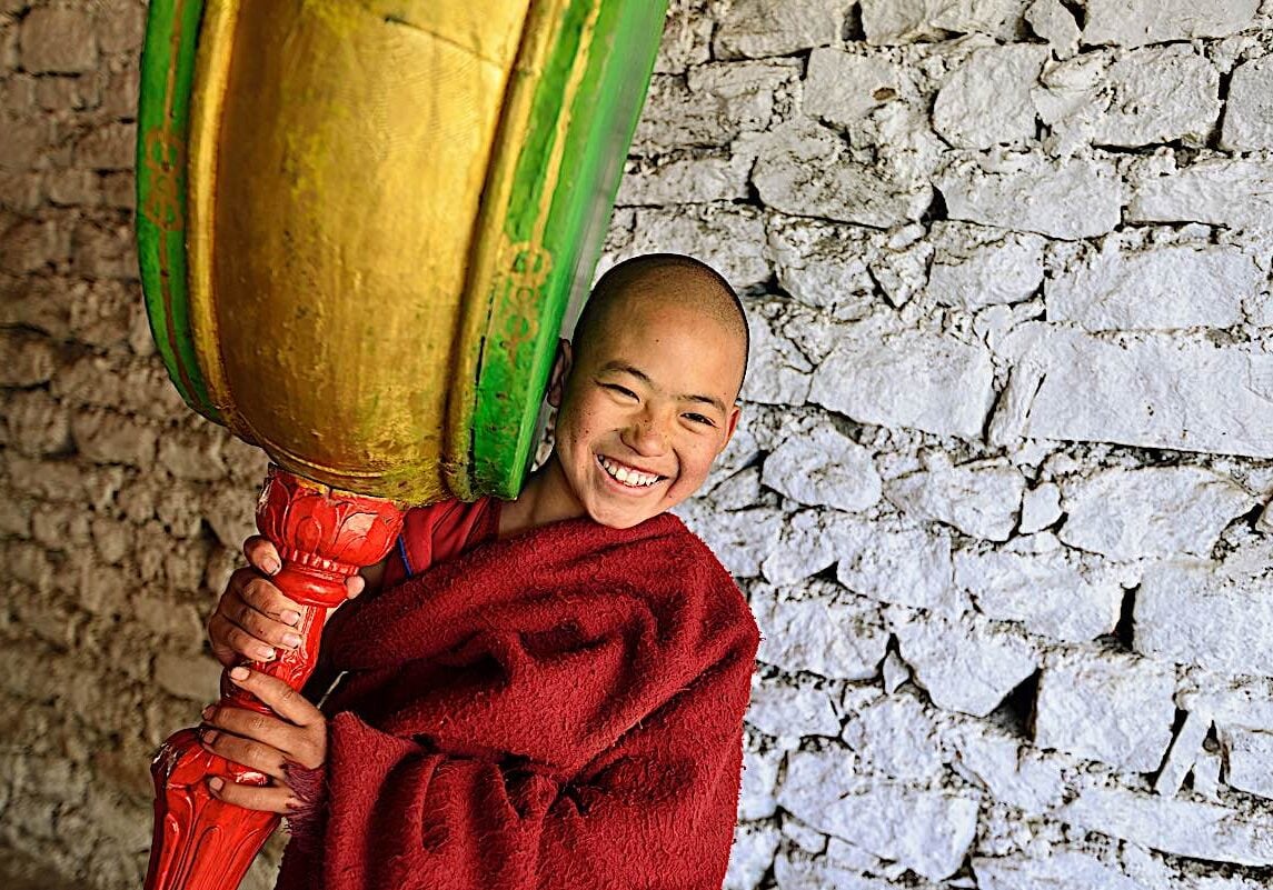 Buddha-Weekly-Buddhist monk plays drum at Tawang Torgya festival at Arunachel Pradesh, India dreamstime_l_164775643-Buddhism A young monk plays a drum at Tawang Togya festival at a temple in Arunachel Pradesh India.