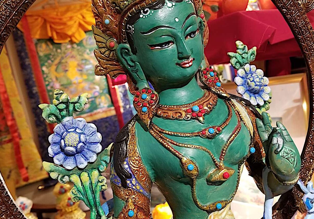 Buddha-Weekly-Chittamani Tara painted by Kam Yu 2-Buddhism A beautiful devotional practice is to paint your own statues. This beautiful "thanka painted" statue of Chittamani Tara started out as an unpainted bronze. Buddha Weekly's volunteer art director Kam Yu, as a devotional practice to Tara, beautifully painted and decorated a Chittamni Tara statue after filling with mantras and blessings. This is one of the most beautiful practices of devotion. He painted the flowers blue, and jewelry in gold foil. The body is matte varnished while the silk clothing with elaborate designs painted on, are glossy. As a final touch he added Turquoise and coral gems.
