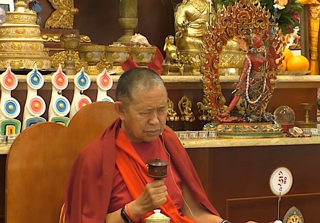 Buddha-Weekly-H E Garchen Rinpoche teaching Vajrayogini with a Dharma Wheel-Buddhism H.E. Garchen Rinpoche spinning a Dharma Wheel at a Higher Yogic teaching on Vajrayogini. Garchen Rinpoche is famous for compassionately spinning the wheel everywhere he can.
