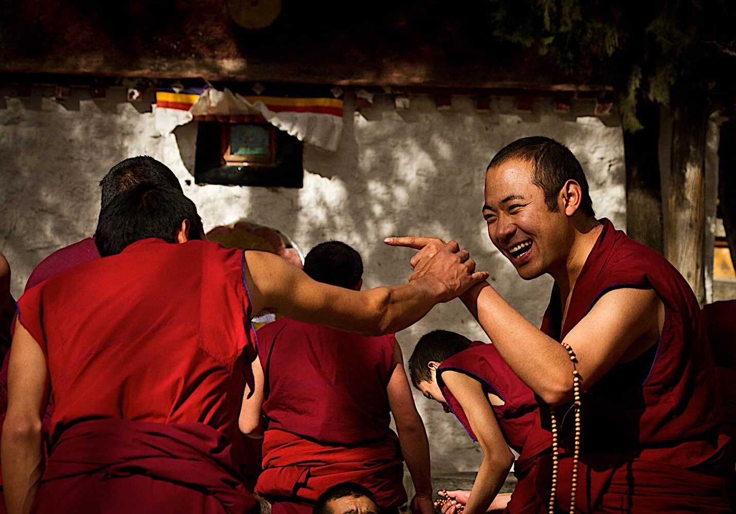 Buddha-Weekly-Happy monks debating at Sera Monestary Buddism dreamstime_l_47717630-Buddhism During a Dharma debate, monks laugh at each other's answers, here at Sera Jey Monestary.