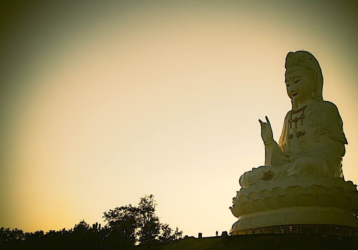 Buddha-Weekly-Mahayana Buddhism Guan Yin dreamstime_xxl_113071020-Buddhism Guan Yin Bodhisattva. The main defining characteristic of Mahayana Buddhism is "loving kindness" and compassion for all beings, symbolized in the great ideal of the Bodhisattva — an Enlightened Being who remains in our relative reality world to help us, rather than moving on to Nirvana's peace.