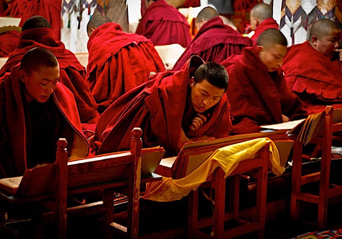 Buddha-Weekly-Monks practicing Sadhana at Drepung Monastery Lhasa Tibet dreamstime_l_47678154-Buddhism Monks practicing Sadhana at a retreat at Drepung Monastery Lhasa, Tibet. Sadhanas are ritualized text that help us learn, but they are also sacred Dharma texts meant to be recited word for word.
