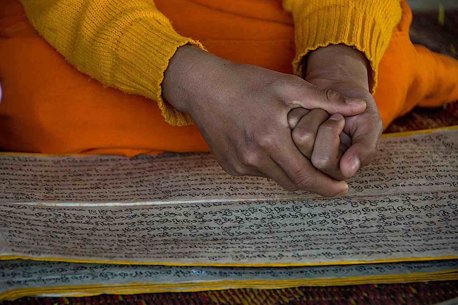 Buddha Weekly Novice monk reading Sanskrit in Laos temple dreamstime xxl 73695741 Buddhism