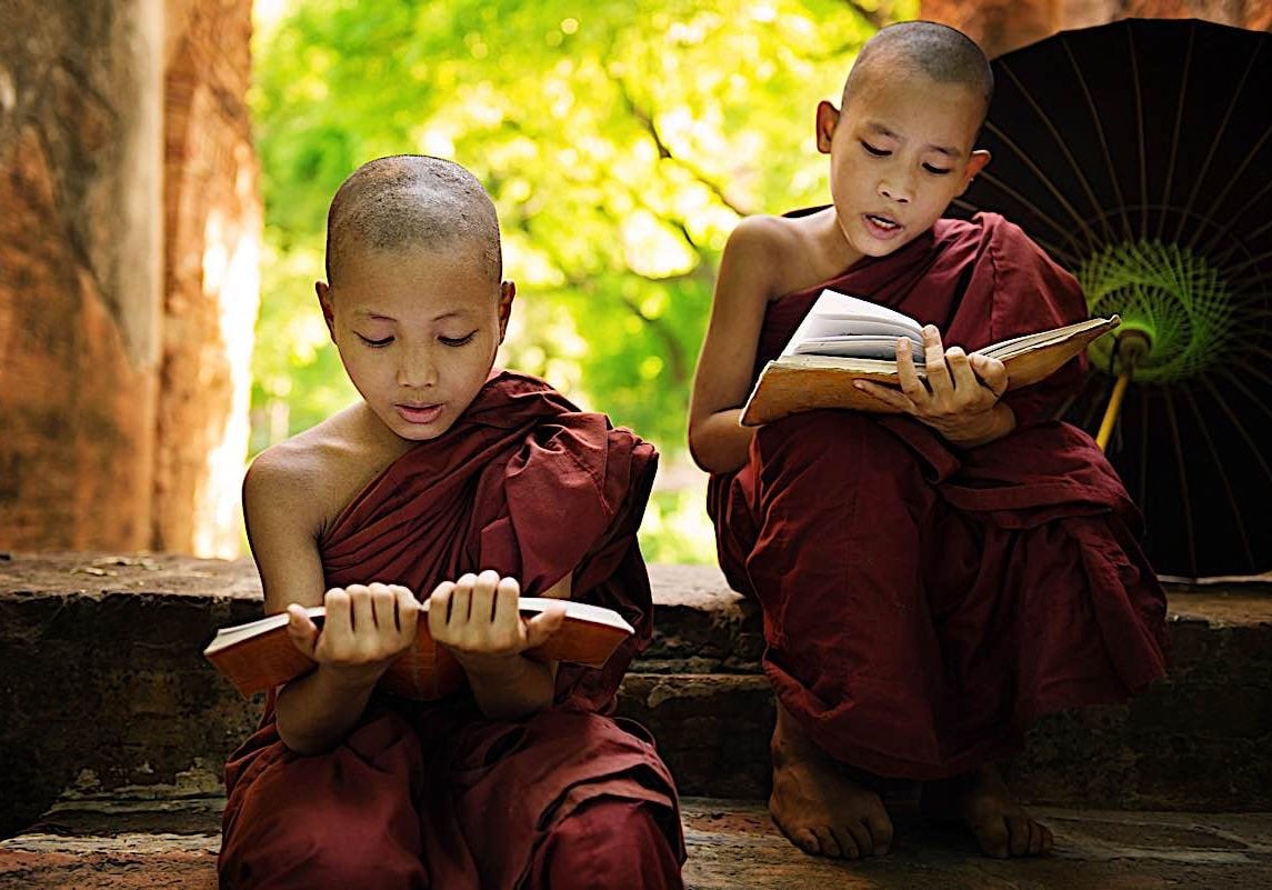 Buddha-Weekly-Rading sutras is a valuable practice here young monks read sutras aloud dreamstime_xxl_33430052-Buddhism Two young monks recite sutras out loud, a meritorious practice.